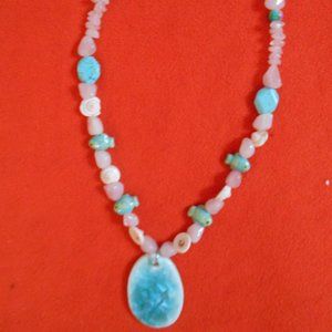 Hnadmade necklace with rose quartz .